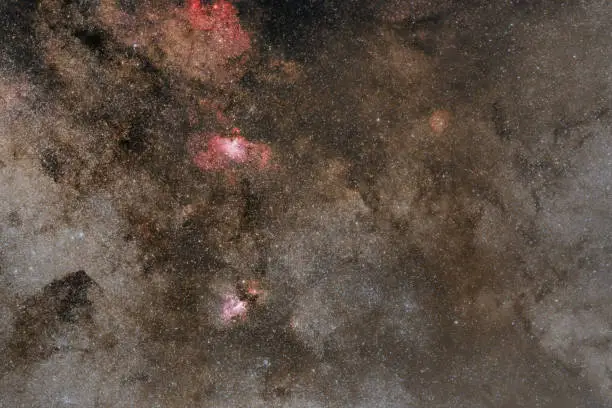 Eagle (Messier 16, NGC 6611) and Omega Nebula (Messier 17, NGC 6618) with part of the milky way on the night sky