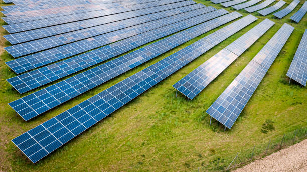 istock Big and blue photovoltaic farm as a renewable energy source. 1366390962