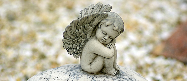 Sad angel on grave