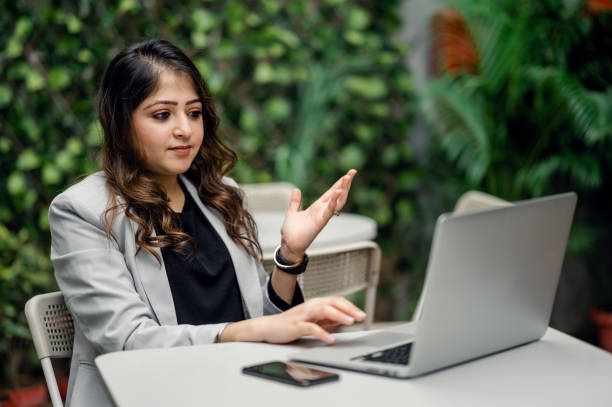 istock Young female professional taking video conference using laptop. 1366392298
