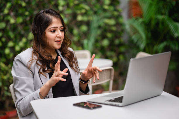 istock Young female professional taking video conference using laptop. 1366392299