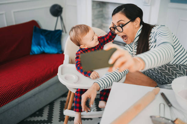 istock Mom makes Christmas cookies with her son 1366393324