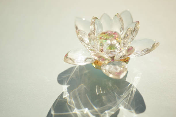 istock Beautiful crystal lotus flower on a green sunny table 1366393339
