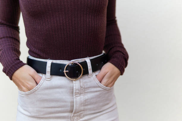 istock Unrecognizable girl with black leather belt 1366393546