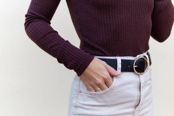 istock Unrecognizable girl with black leather belt 1366393560