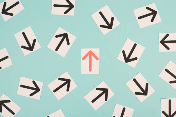istock Many black arrows, one red is standing out, do different, be a winner, individuality, making your own decision, leadership 1366394403