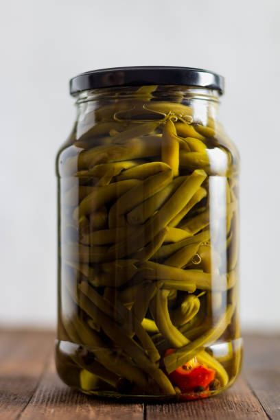 istock pickled beans in a glass jar on a wooden table 1366395832