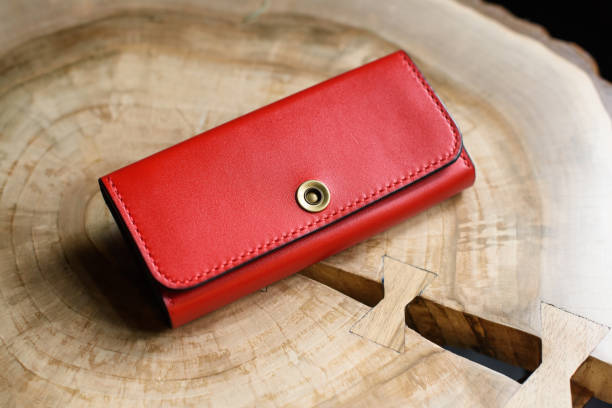 istock hand made red leather wallet . Leather craft. Selective focus 1366396718