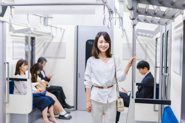 istock Young woman riding the train with a smile 1366400111