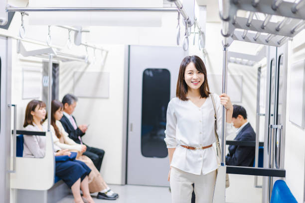 istock Young woman riding the train with a smile 1366400116