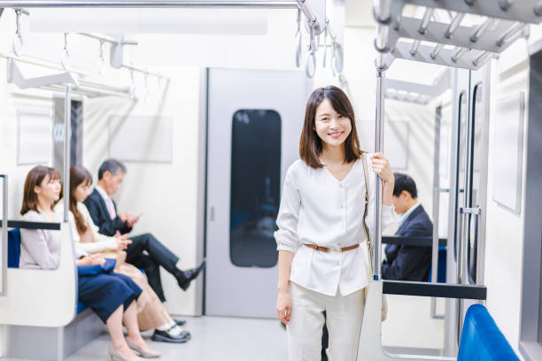istock Young woman riding the train with a smile 1366400121