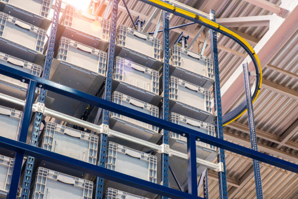 istock Huge distribution warehouse with high shelves and loaders. Bottom view. 1366400369