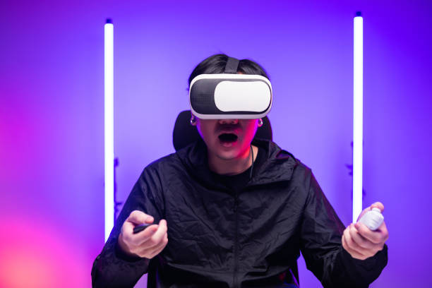 istock Young man interesting with virtual simulated world. Into the future digital cyber universe. Future technology vr concept. 1366400437