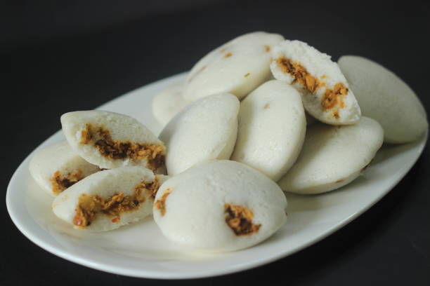 istock Chicken Stuffed steamed rice cake. Steamed rice cake stuffed with Chicken masala. Commonly called chicken stuffed Idli in Kerala. Served with coconut chutney 1366400833