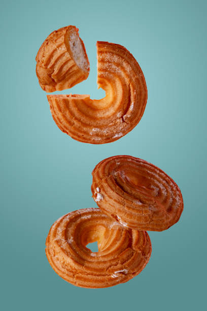 istock custard bagels in powdered sugar fly on a blue background 1366401946
