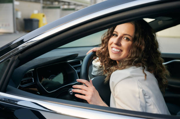 istock Female driver resting in her favorite automobile. 1366402826