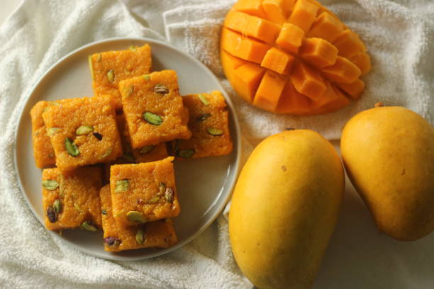 istock Mango fudge or Mango barfi or Mango kalakand. A mango version of Indian sweet dish Kalakand. 1366403049