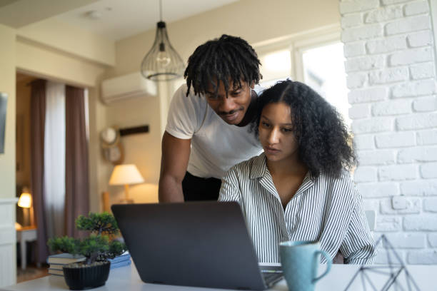 istock A boyfriend and girlfriend looking at a laptop screen together 1366405385