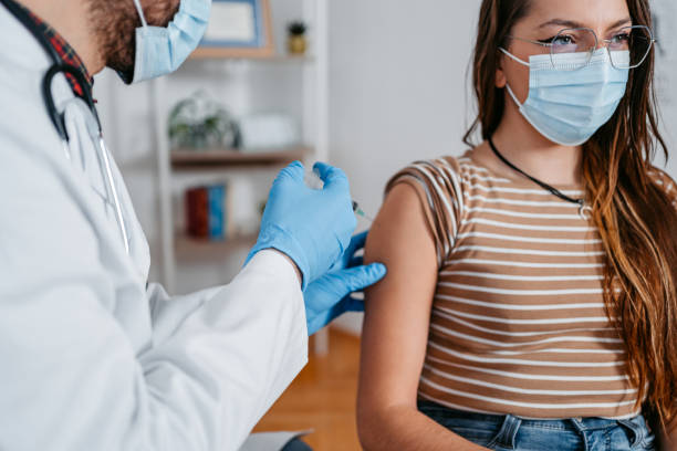 istock Young Woman Getting Vaccinated By The Doctor 1366406907