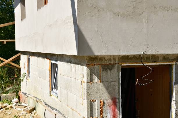 istock Saving heat in the house by insulating the walls with polystyrene 1366406997