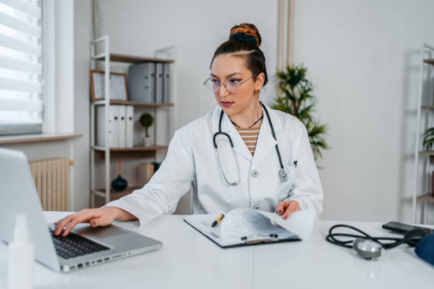 istock Female Doctor Using Laptop In The Office 1366407042