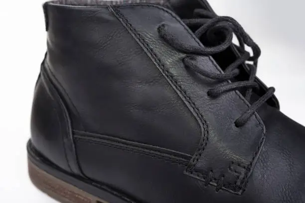 Closeup of male black Leather ankle shoes