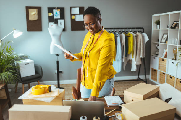 istock Working woman at online shop. 1366409148
