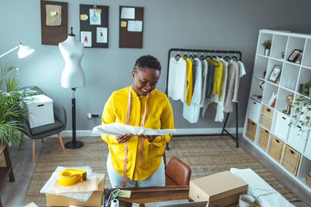 istock Woman selecting home interior paint color from swatch catalog 1366409375