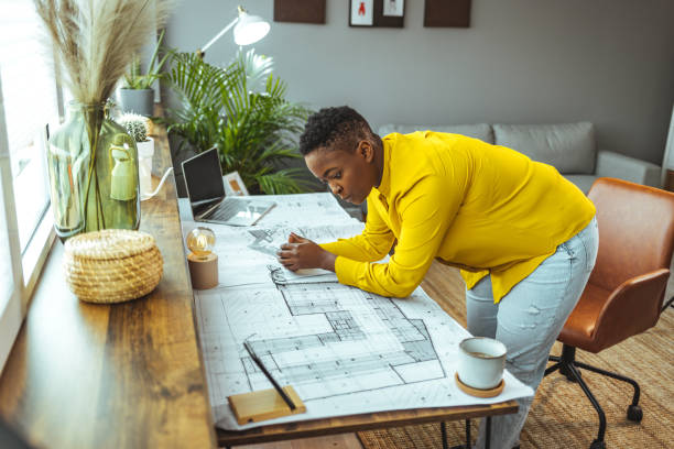 istock Female architect working at home 1366409605