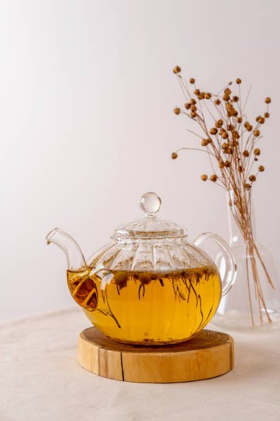 istock Hot herbal tea is in the glass teapot on the table. Copy space. 1366410158