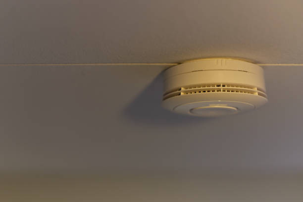 istock smoke and fire sensor at the ceiling of a room 1366411519