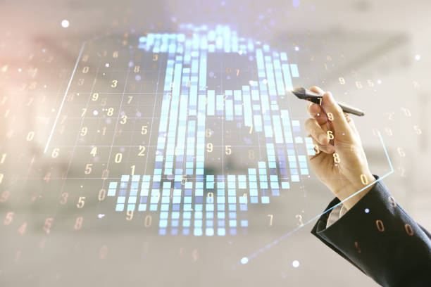 istock Man hand with pen working with virtual Bitcoin sketch on blurred office background. Double exposure 1366412177