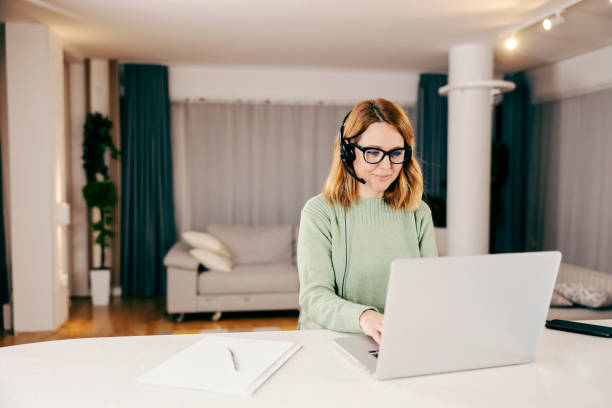 istock A teleworker working online from her cozy home on her laptop and typing. 1366418007