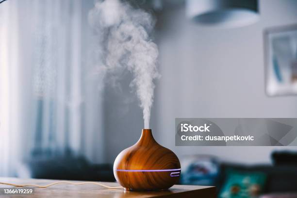 Humidifier With Steam Moisturizing Air At Home Stock Photo - Download Image Now - Aromatherapy Diffuser, Aromatherapy Oil, Steam