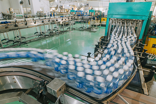 mineral water Factory production line at finishing line in a row bottle moving queuing for labelling packing