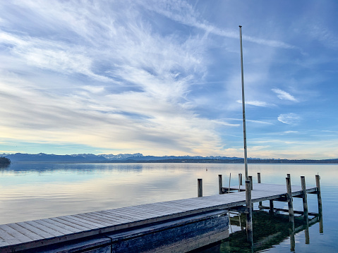 Jetty by the Lake Starnberg with the Alps in background