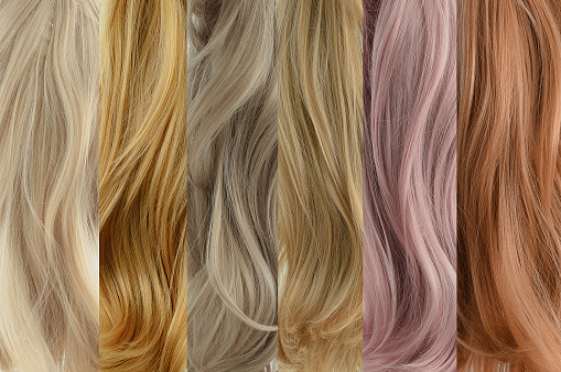 Six samples of blonde hair strands in different shades. Hair coloring.