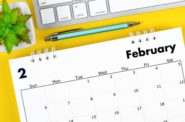 istock February 2022 desk calendar and diary with keyboard computer. 1366423646