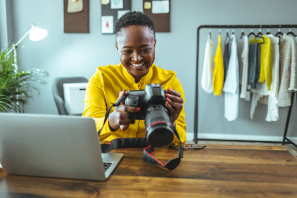 istock Photographer holding a dslr camera in her hand 1366425919