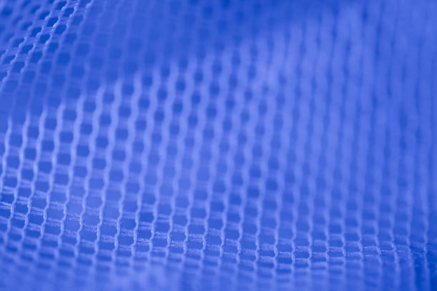 Mesh in blue led light Mesh in blue led light soft focus Backgrounds spandex stock pictures, royalty-free photos & images