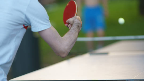 istock small racket, ball for table tennis in a player's hand 1366427632