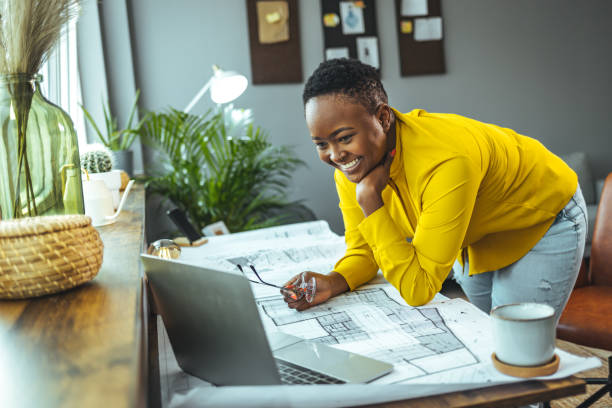 istock Female architect working at home 1366427922