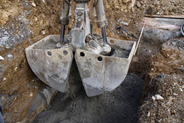 istock Liquid concrete is filled into a foundation with a gripper 1366428450