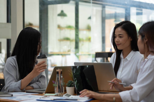 istock Business asian team collaboration discussing working analyzing with financial data and marketing growth report graph in team, presentation and brainstorming to strategy planning making profit of company 1366429123