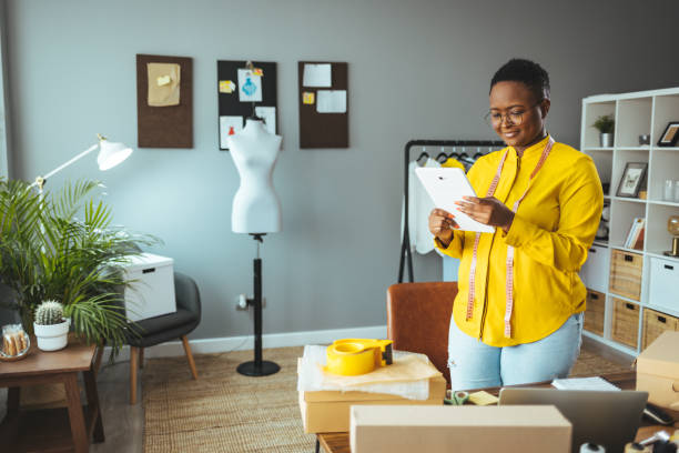 istock Working woman at online shop. 1366430376