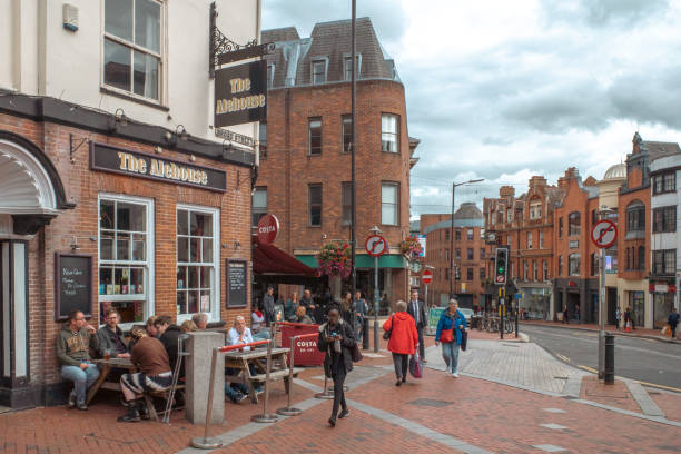 People walking past pub at Broad Street, Reading, England, United Kingdom stock photo