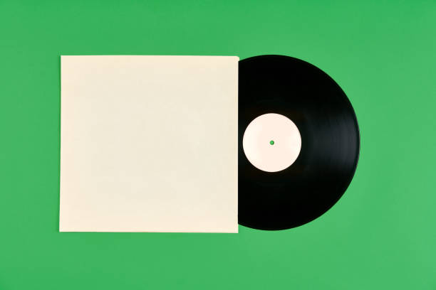 istock Vinyl record with cover mockup isolated over green background 1366433558