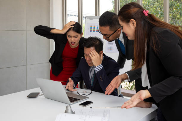 istock Manager and business team check information in laptop comparing with stress feeling emotion 1366433778