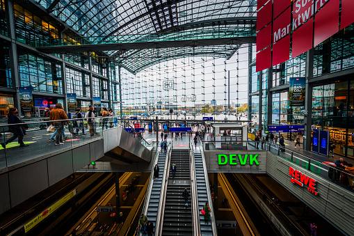 Berlin, Germany - November 01, 2021: View inside of the Berlin Main Train Station - Hauptbahnhof. A lot of escalators and elevators between the railroad station plattforms.
