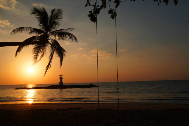 istock Landscape nature sunset and red  twilight sky with Silhouette  lighthouse coconut tree at Nang Thong Beach at Khao Lak Phang Nga Thailand - Seascape chill vibe on the beach - beautiful sky 1366438832